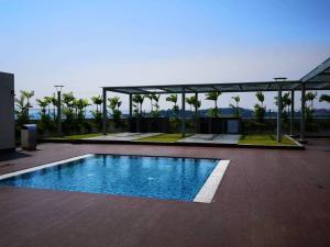 a swimming pool on top of a building at Harmony Studio @ Evo SOHO Bangi in Kampong Sungai Ramal Dalam