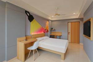 Кровать или кровати в номере Ginger Madgaon, Goa