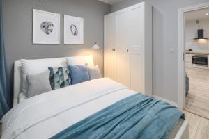 Łóżko lub łóżka w pokoju w obiekcie Native Apartments Starowiślna 33A Deluxe