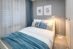 Łóżko lub łóżka w pokoju w obiekcie Native Apartments Starowiślna 33A Deluxe