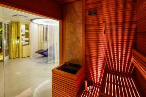 a hallway of a house with a red wall at Hotel Lemongarden - Adults Only in Sutivan