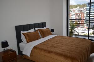 A bed or beds in a room at Luxury Residence Suites