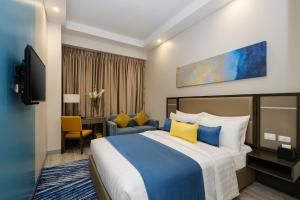 Ένα ή περισσότερα κρεβάτια σε δωμάτιο στο Savoy Hotel Mactan