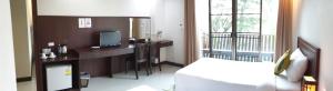 A bed or beds in a room at Kong Garden View Resort Chiang Rai