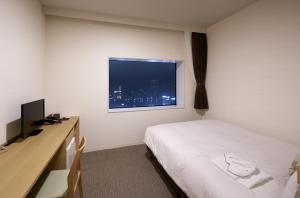 Postel nebo postele na pokoji v ubytování Hotel Crown Hills Ueno Premier