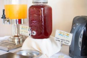a jar of jam sitting on top of a counter at Riviera Perdika Hotel in Perdika