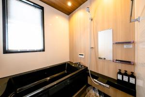 a bathroom with a sink and a mirror at 22 ORIYA Mt Fuji -錦NISHIKI- in Fujikawaguchiko +74 photos