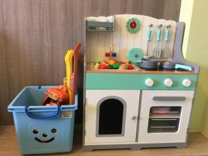 a toy kitchen with a sink and a stove at Mi Casa B&B in Taitung City +35 photos