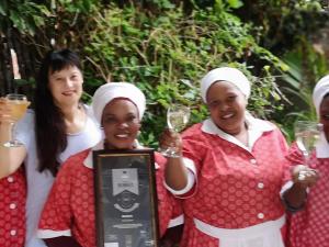 a group of women holding up glasses of wine at Rose and Ale Self Catering Units in Gonubie