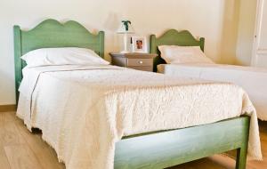 Un pat sau paturi într-o cameră la Agriturismo La Perla