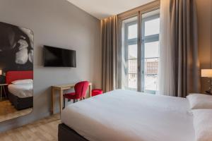 Un ou plusieurs lits dans un hébergement de l'établissement Ibis Styles Toulouse Capitole