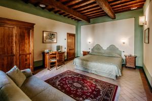Säng eller sängar i ett rum på Dimora Casa Eugenia
