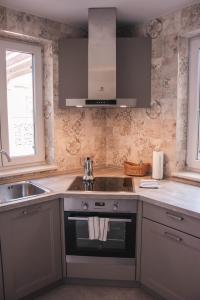 Kuchyň nebo kuchyňský kout v ubytování Salinea Apartments