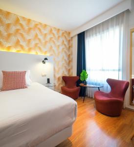 En eller flere senger på et rom på Hotel Cetina Murcia
