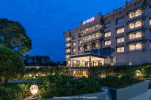 a rendering of a hotel at night at Clarks Inn Suites Raipur in Raipur