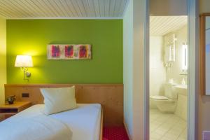 Letto o letti in una camera di Hotel La Cruna