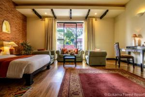 Voodi või voodid majutusasutuse Gokarna Forest Resort Kathmandu toas