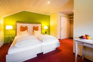 Letto o letti in una camera di Hotel La Cruna