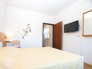 Ένα ή περισσότερα κρεβάτια σε δωμάτιο στο Apartment Liznjan 1969
