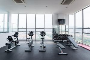 a gym with treadmills and exercise equipment in a building at Madam Design 1 at Kota Damansara in Petaling Jaya