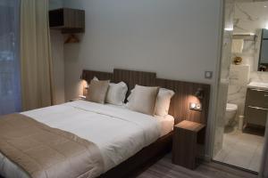 Cama ou camas em um quarto em Hotel Puy De Dôme