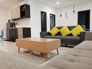 a living room with a couch and a coffee table at Petaling Jaya Atria Sofo Suite in Petaling Jaya