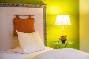 Letto o letti in una camera di Hotel La Cruna
