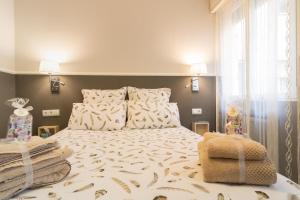 San Pietro Home La Rioja tesisinde bir odada yatak veya yataklar