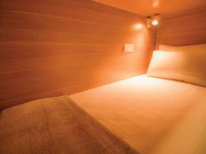 Postel nebo postele na pokoji v ubytování Hexa Hotel & Backpackers Capsules Bukit Bintang
