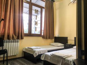 Postel nebo postele na pokoji v ubytování Hotel Victoria