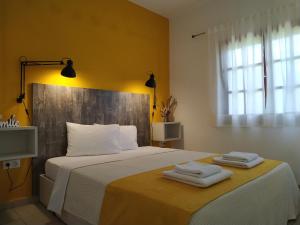 A bed or beds in a room at Aitherial Summer House
