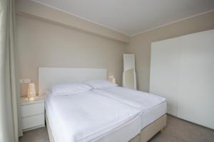 Postel nebo postele na pokoji v ubytování Król Plaza Spa & Wellness