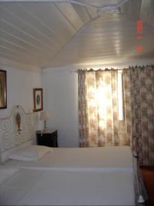 Uma cama ou camas num quarto em Casa da Figueira Velha
