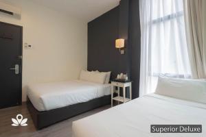 Postel nebo postele na pokoji v ubytování Ceria Hotel