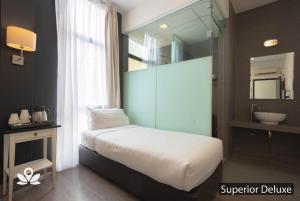 Postel nebo postele na pokoji v ubytování Ceria Hotel