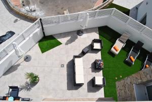 an overhead view of a patio with tables and chairs at Big Villa Tauro with Private Heated Saltwater Pool & jacuzzi & BBQ & Game Room in Mogán