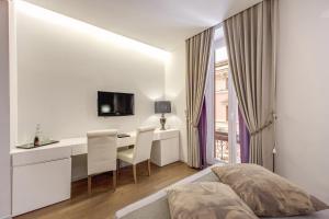 Katil atau katil-katil dalam bilik di Roma Boutique Hotel