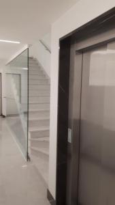 a glass door in a building with a staircase at LIVING ROME Int 2 in Rome