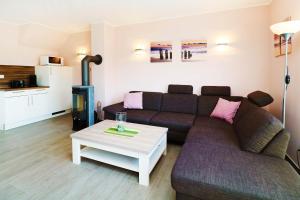 Et opholdsområde på Ferienhaus Wis mit Sauna