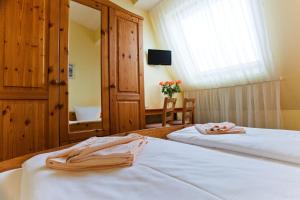 Postel nebo postele na pokoji v ubytování Hotel Atlantic