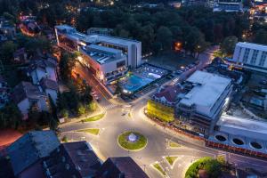 an overhead view of an intersection in a city at night at Hotel Tonanti in Vrnjačka Banja