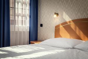 Voodi või voodid majutusasutuse Hotel Ruze toas