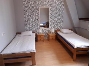 Posteľ alebo postele v izbe v ubytovaní Hostel Universus