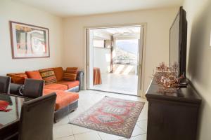 a living room with a couch and a table at Ninfa Apartment - Taormina Holidays in Taormina