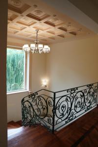 En eller flere senge i et værelse på Villa Princi