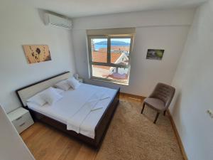 Postel nebo postele na pokoji v ubytování AS Apartments Rafailovici