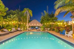 a swimming pool in a resort at night at Siesta Key Palms Resort in Sarasota