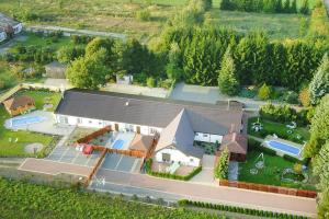 an aerial view of a house with a tennis court at VILLA DANIELA II in Sieciemin