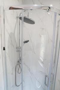 a shower with a glass door in a bathroom at Villa Princi in Villa San Giovanni