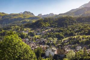 a town in a valley in the mountains at Maison Paquier - Central Family Escape in Valtournenche